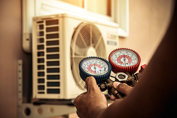 Professional Air Conditioning Service technician working in Laurel, MT